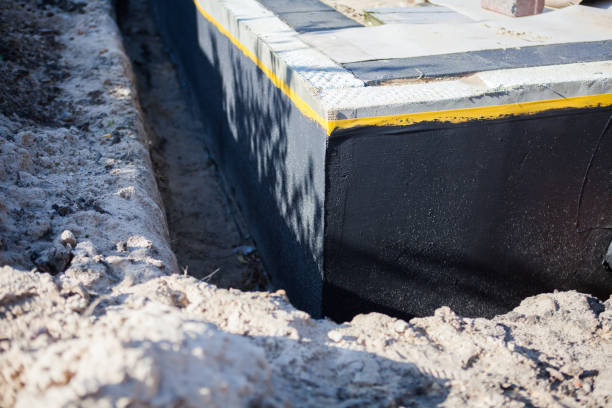 Professional Basement Waterproofing technician working in Mount Sinai, NY